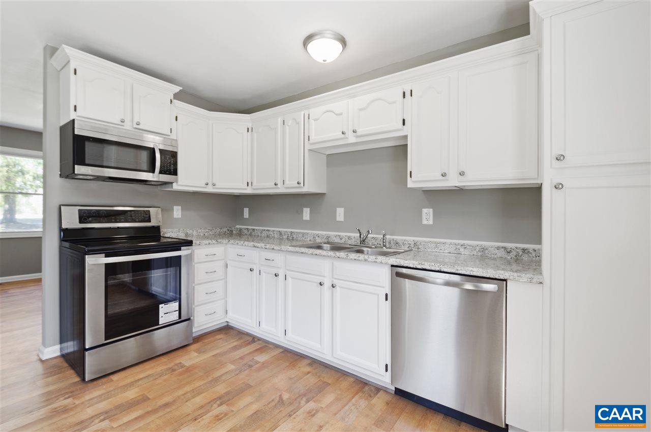 3915 Stage Junction Road Columbia, VA 23038 - Photo 2 of 11 a kitchen with stainless steel appliances granite countertop a stove a sink and a microwave