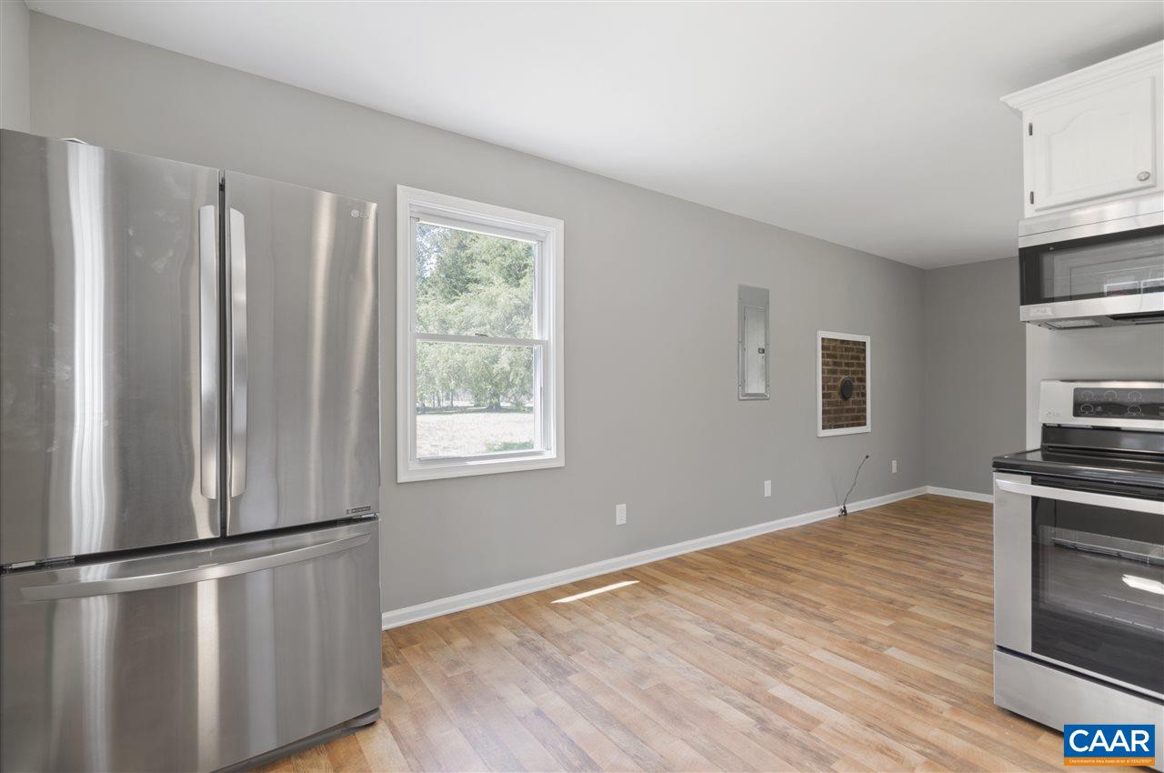 3915 Stage Junction Road Columbia, VA 23038 - Photo 3 of 11 a view of kitchen with wooden floor and electronic appliances