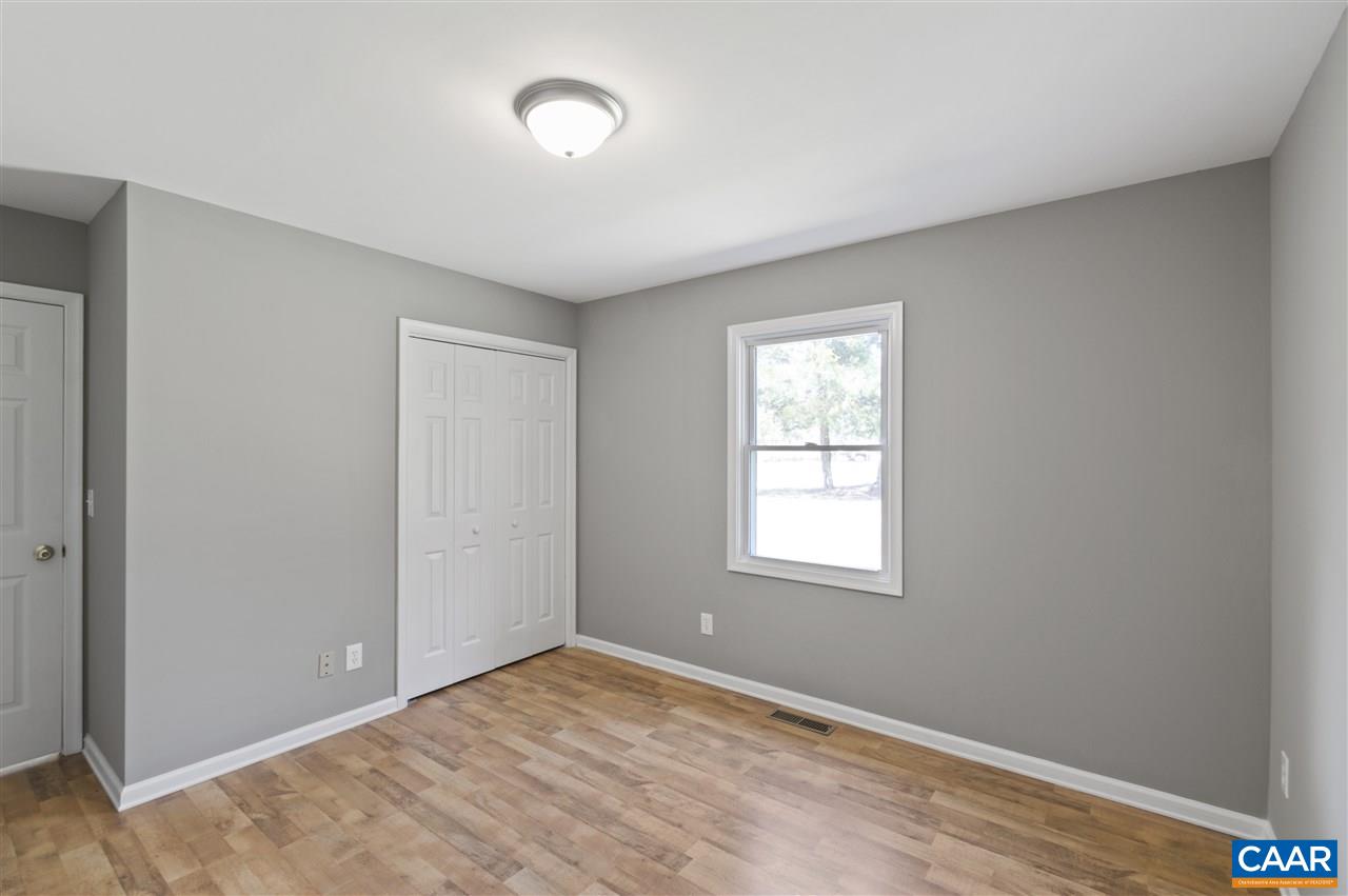 3915 Stage Junction Road Columbia, VA 23038 - Photo 8 of 11 an empty room with windows