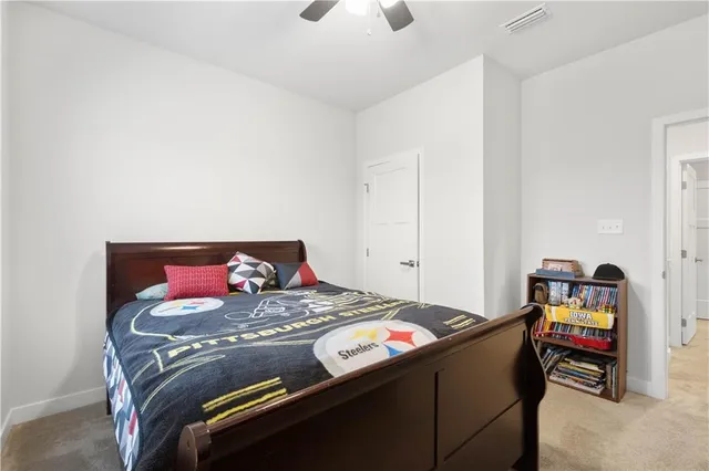 a bedroom with a bed and a dresser