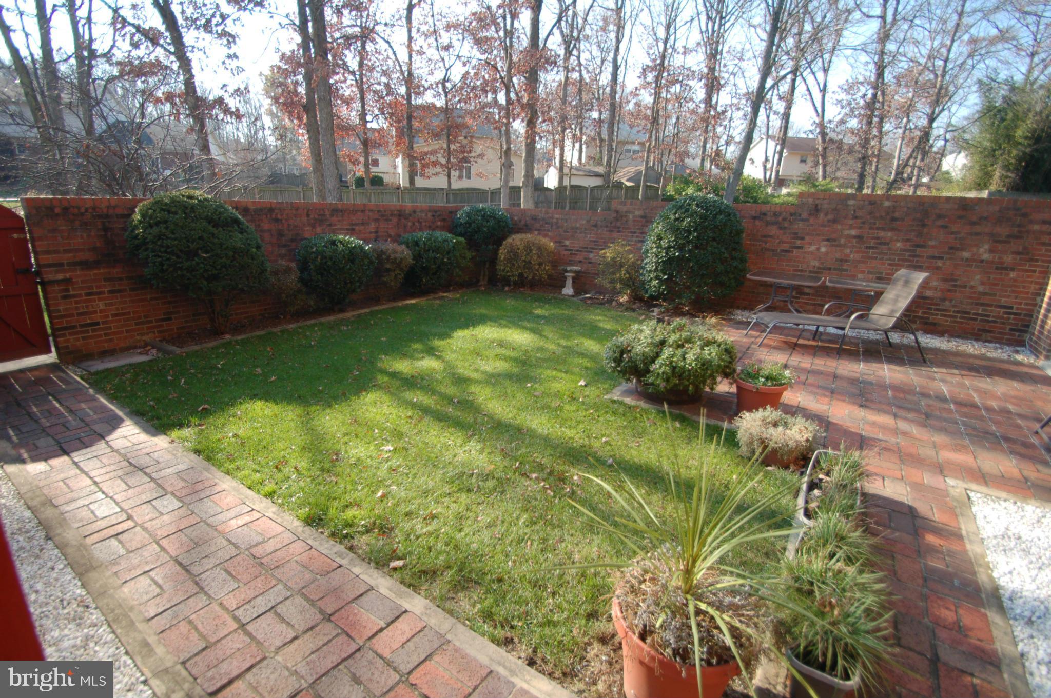8515 Lakinhurst Lane Springfield, VA 22152 - Photo 25 of 30 Backyard surrounded by trees and common area