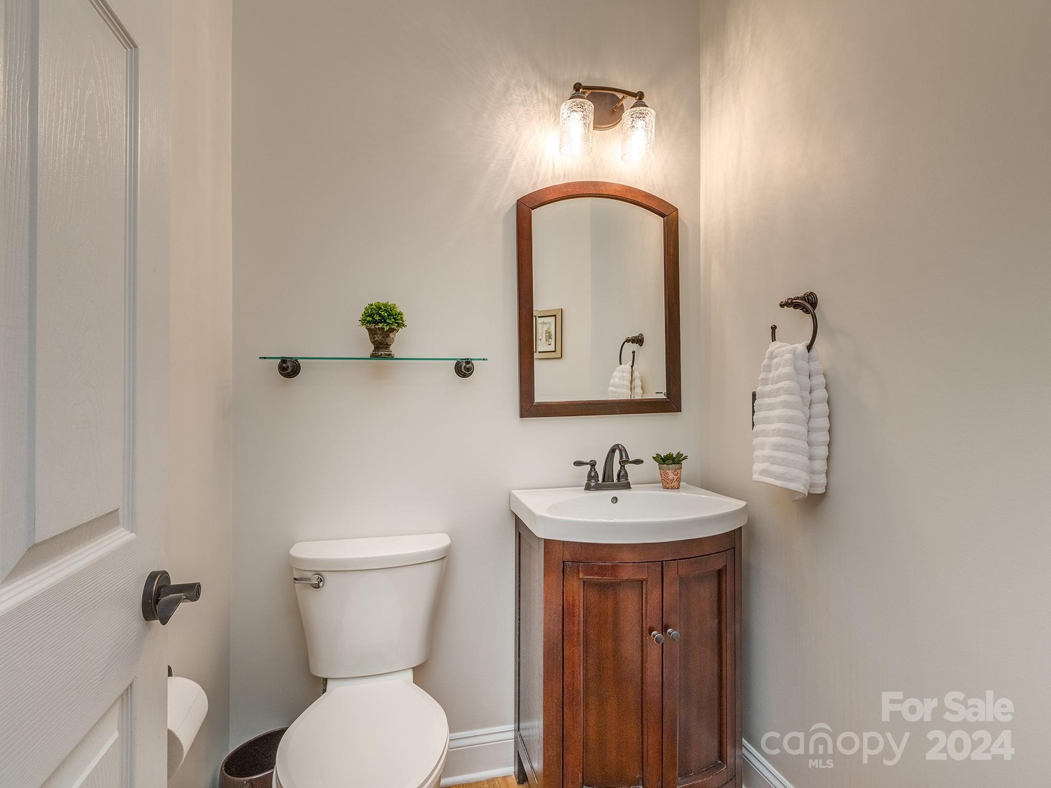 2028 Maynard Road Charlotte, NC 28270 - Photo 11 of 34 a bathroom with a toilet sink and mirror
