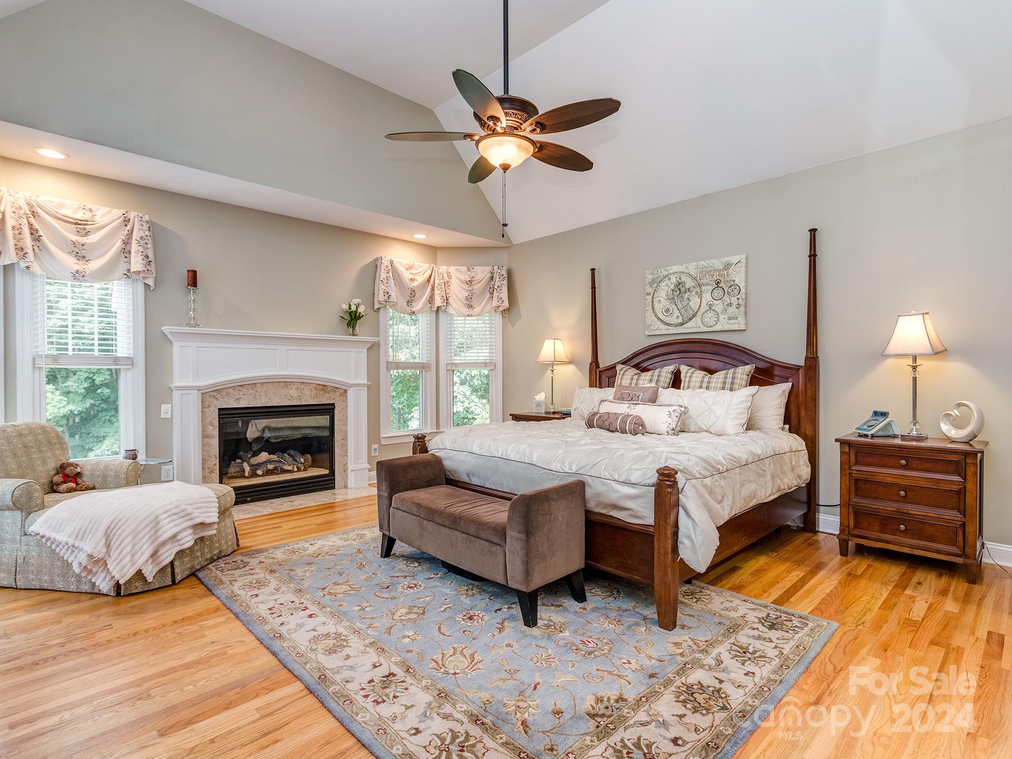 2028 Maynard Road Charlotte, NC 28270 - Photo 12 of 34 a bedroom with a bed and a fireplace