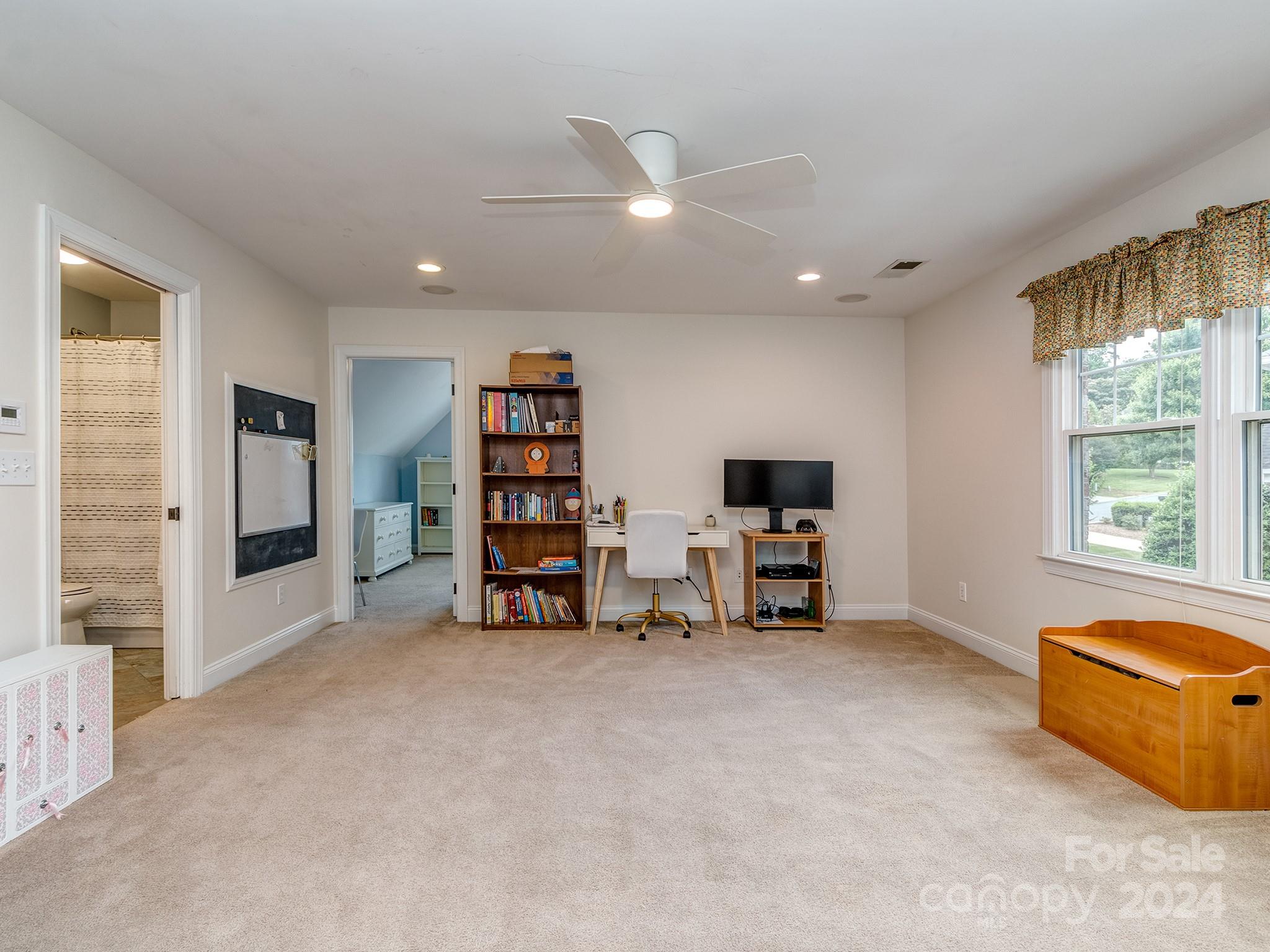 2028 Maynard Road Charlotte, NC 28270 - Photo 21 of 34 a living room with furniture and a flat screen tv