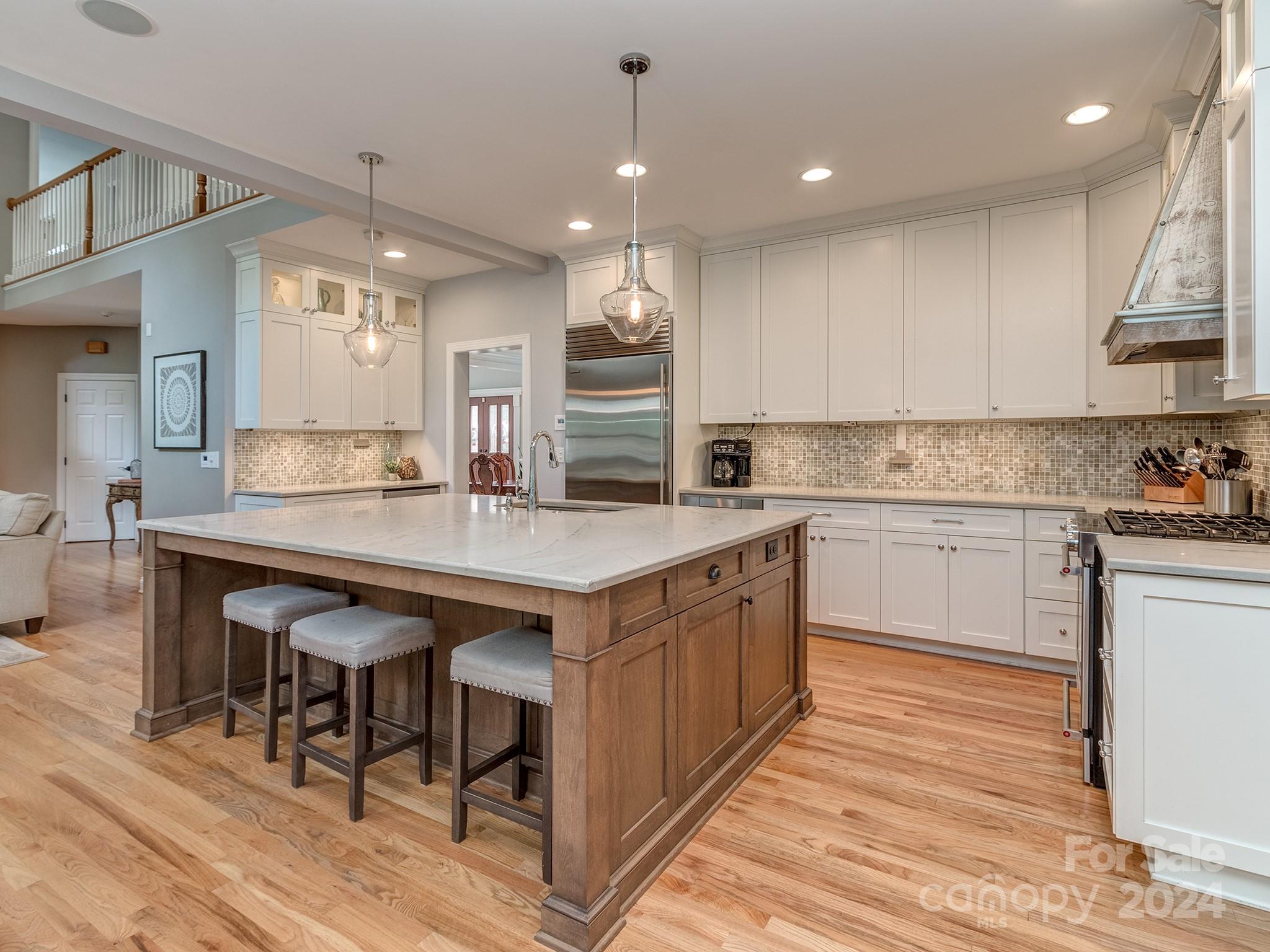 2028 Maynard Road Charlotte, NC 28270 - Photo 5 of 34 a kitchen with a sink cabinets and wooden floor