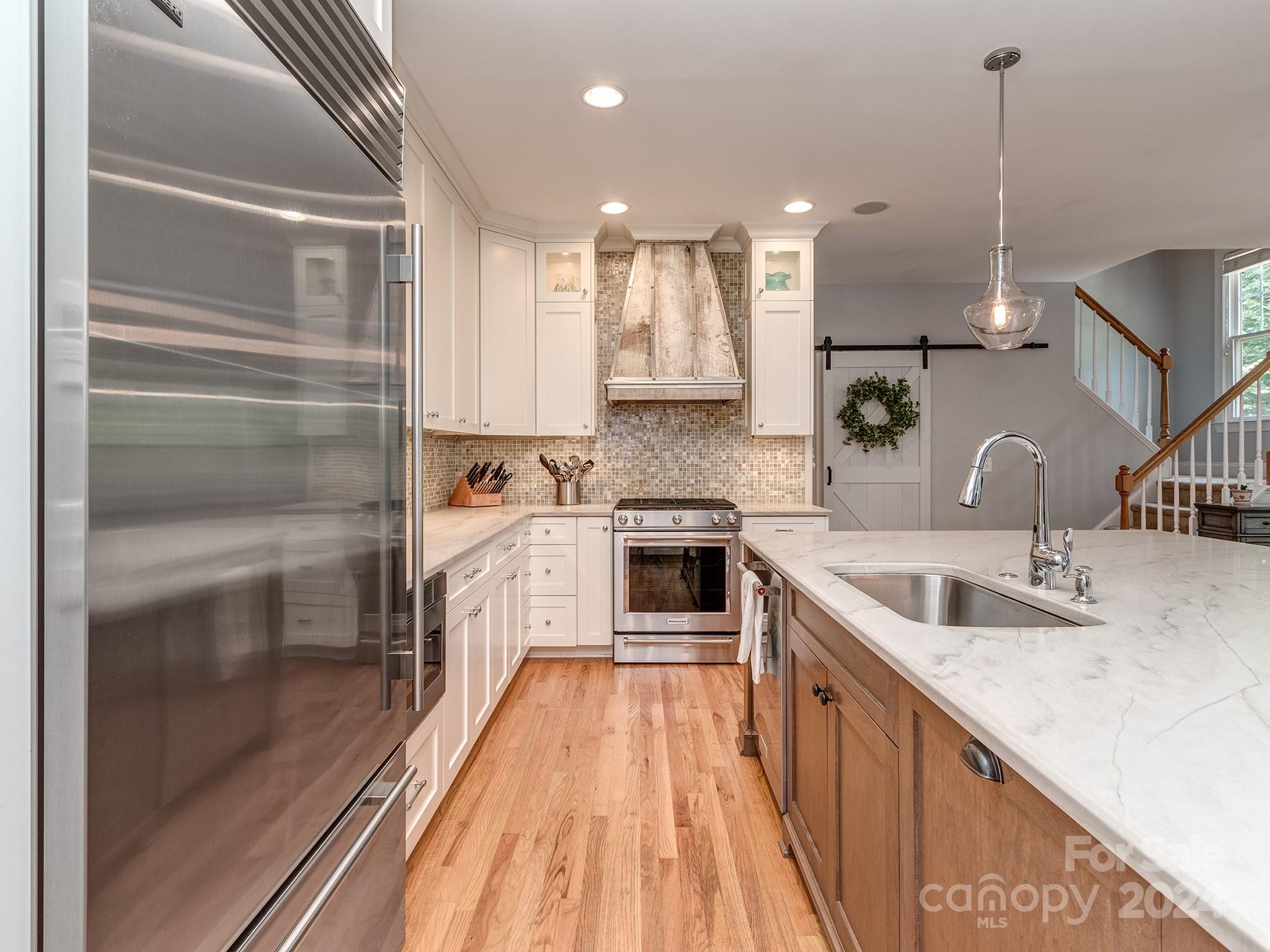 2028 Maynard Road Charlotte, NC 28270 - Photo 6 of 34 a kitchen with a sink stove and refrigerator