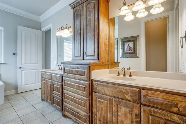 a bathroom with a sink vanity and mirror