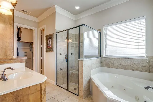 a bathroom with a bathtub and a sink