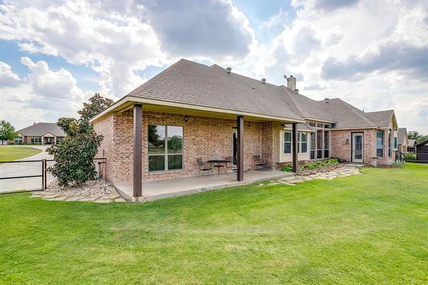 a front view of a house with a garden and porch