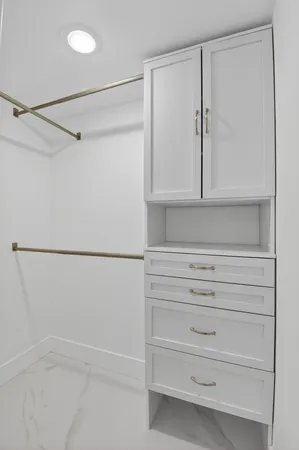 a view of an empty walk in closet