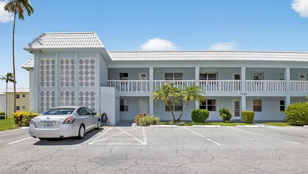 a front view of a house with a patio