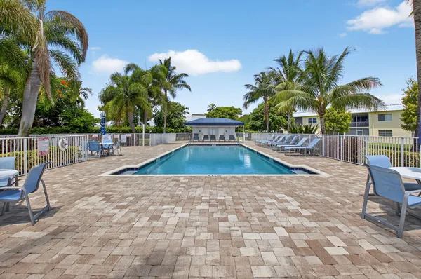 a view of a swimming pool with a patio
