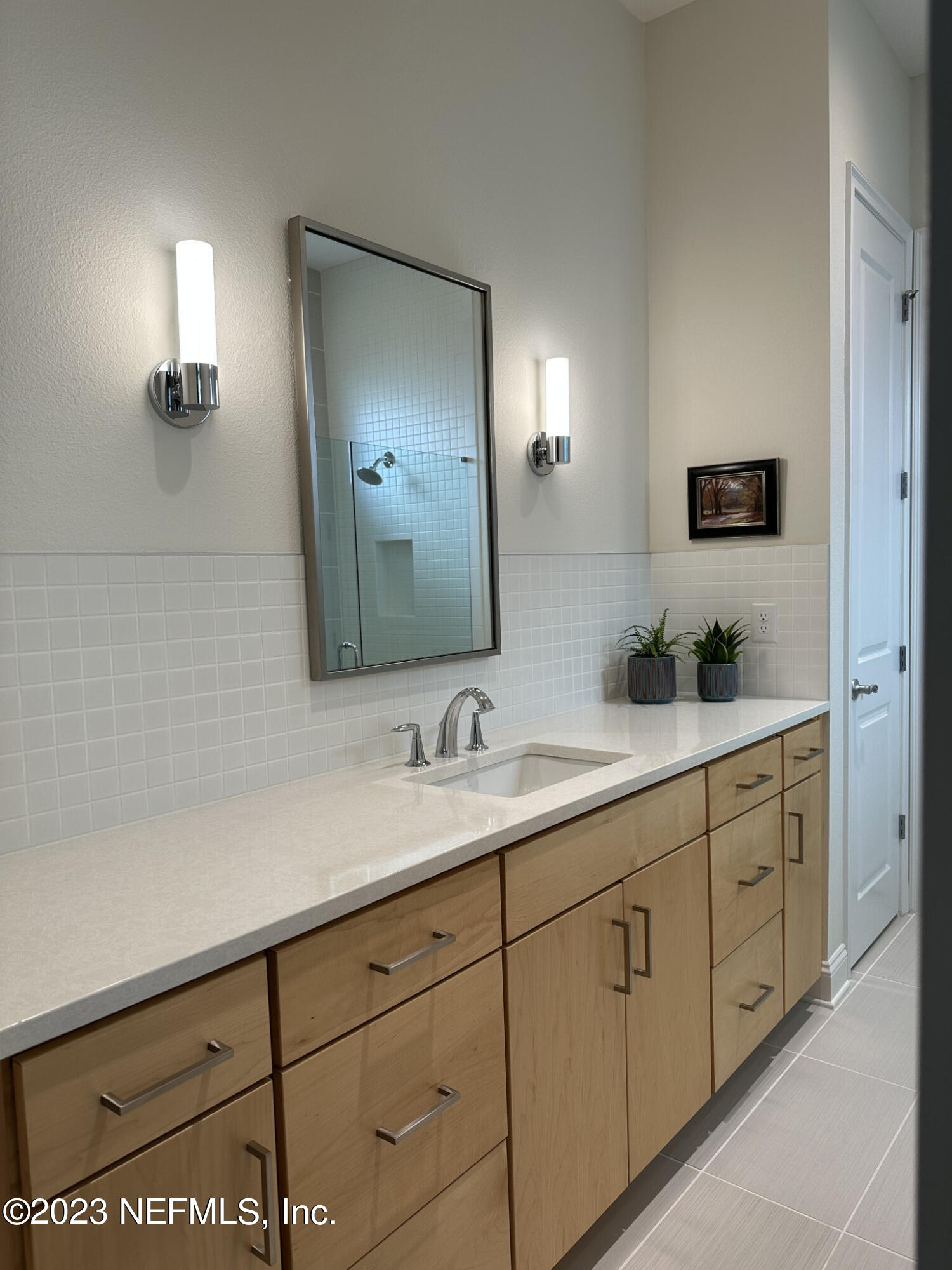 44 Rinaldo Way Ponte Vedra, FL 32081 - Photo 21 of 30 a bathroom with a double vanity sink and a mirror