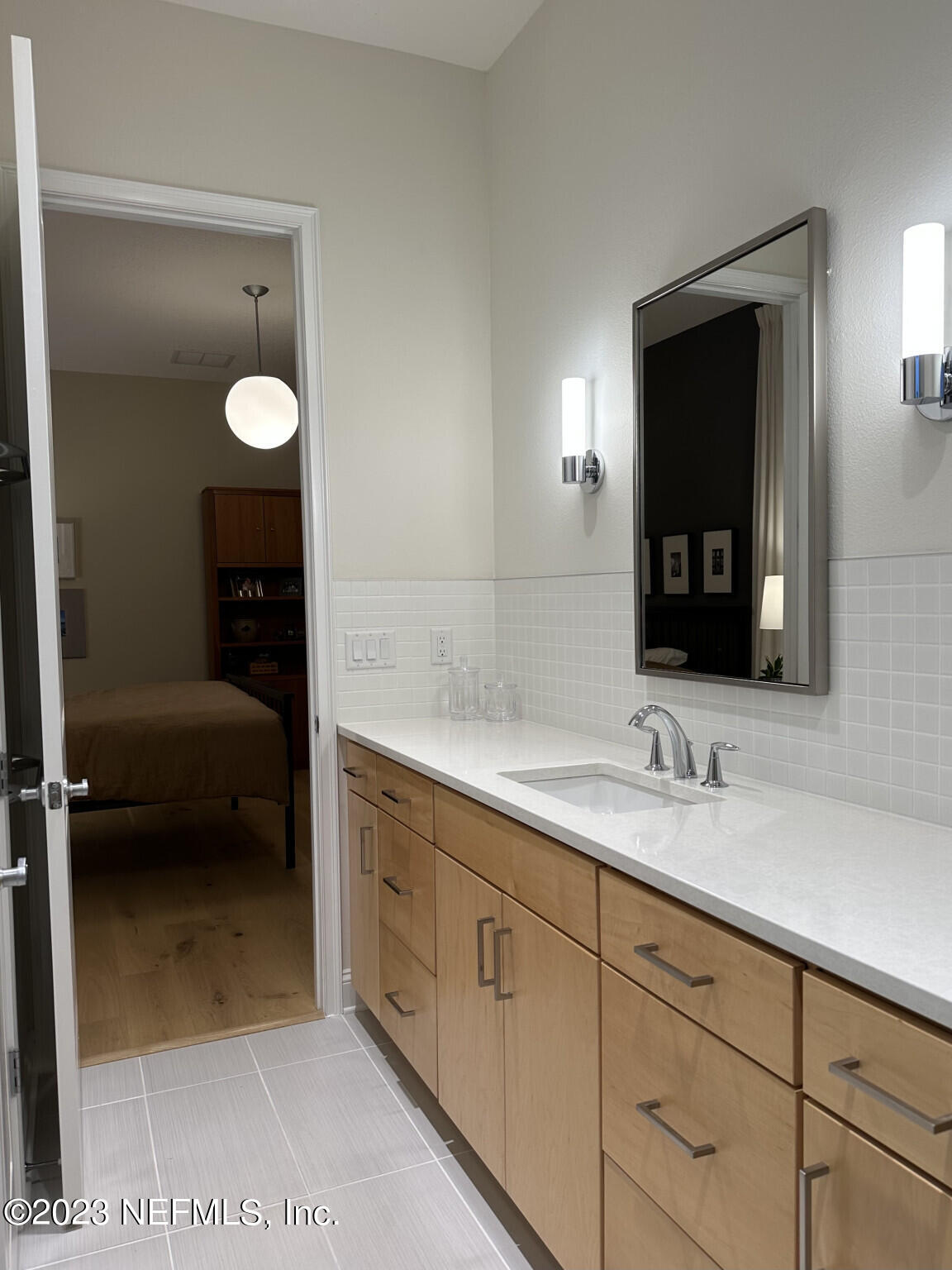 44 Rinaldo Way Ponte Vedra, FL 32081 - Photo 23 of 30 a en suite bathroom with a granite countertop sink and a mirror