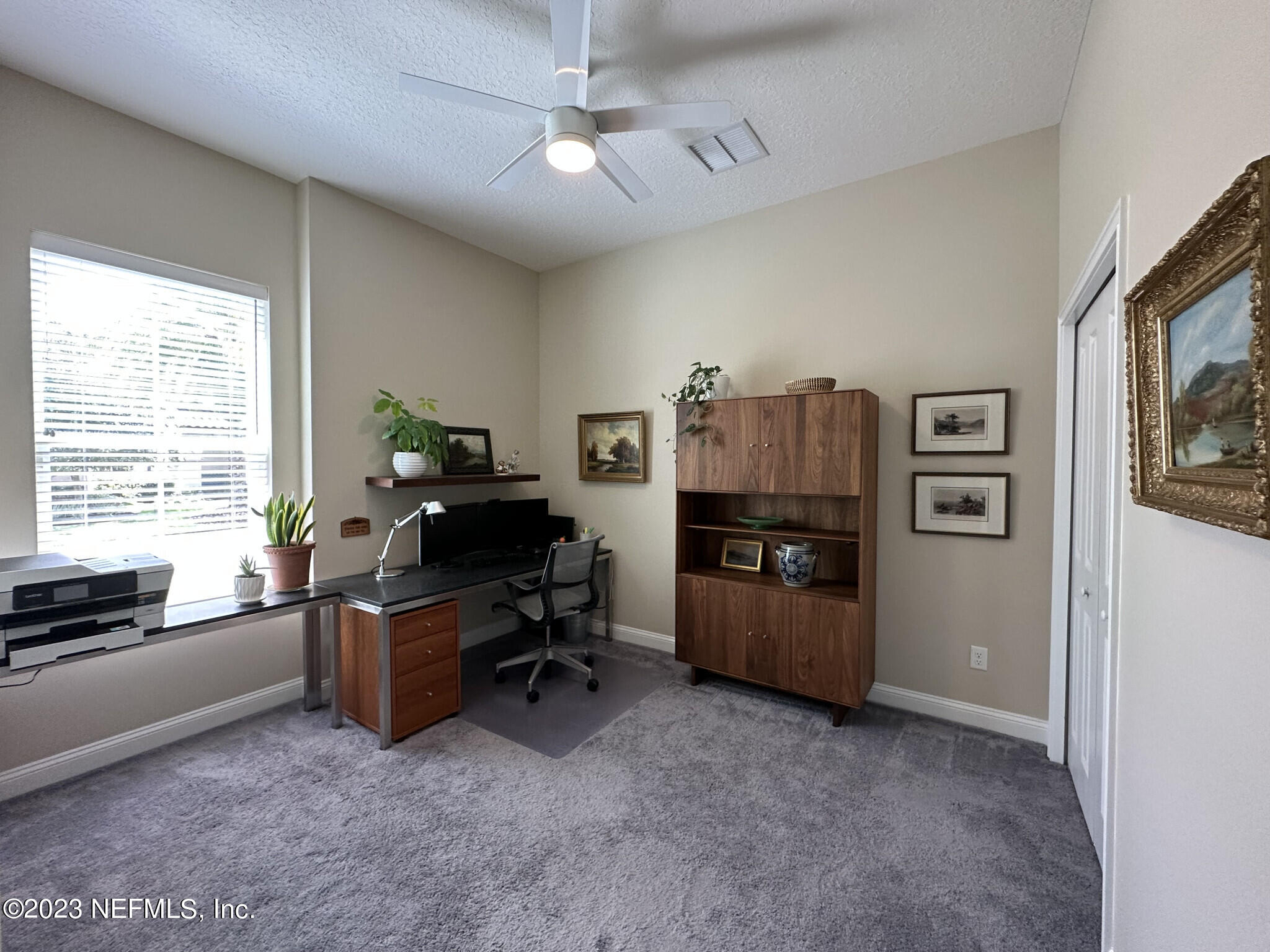 44 Rinaldo Way Ponte Vedra, FL 32081 - Photo 28 of 30 a view of a workspace with furniture and a window