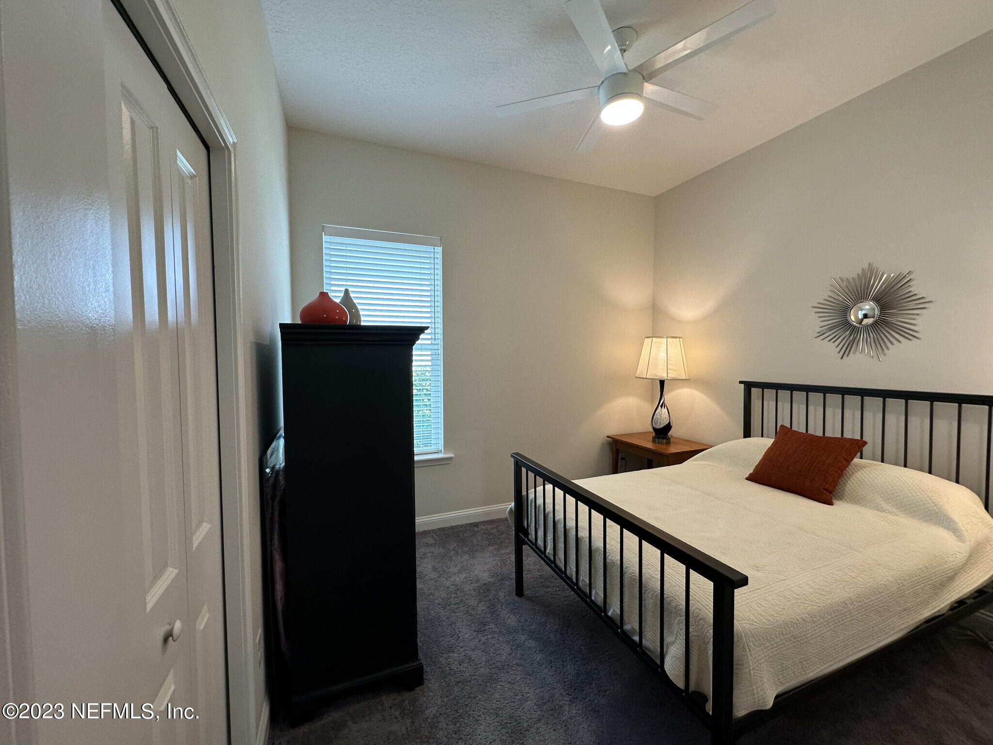 44 Rinaldo Way Ponte Vedra, FL 32081 - Photo 29 of 30 a bedroom with a bed and a lamp