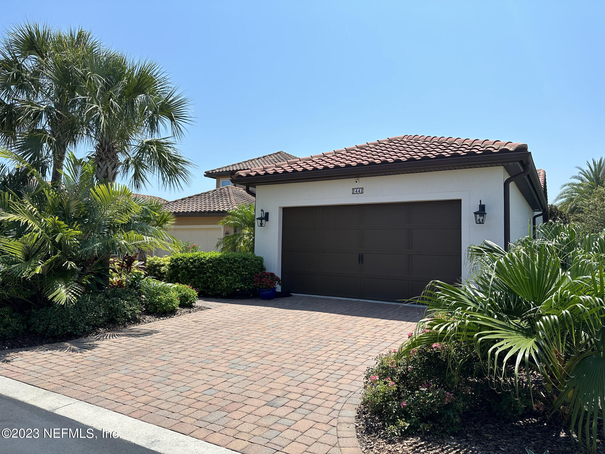 44 Rinaldo Way Ponte Vedra, FL 32081 - Photo 3 of 30 a front view of a house with a garden