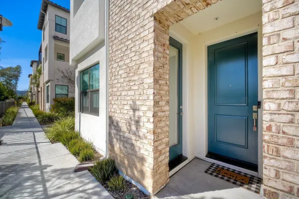 a view of a brick house with a street