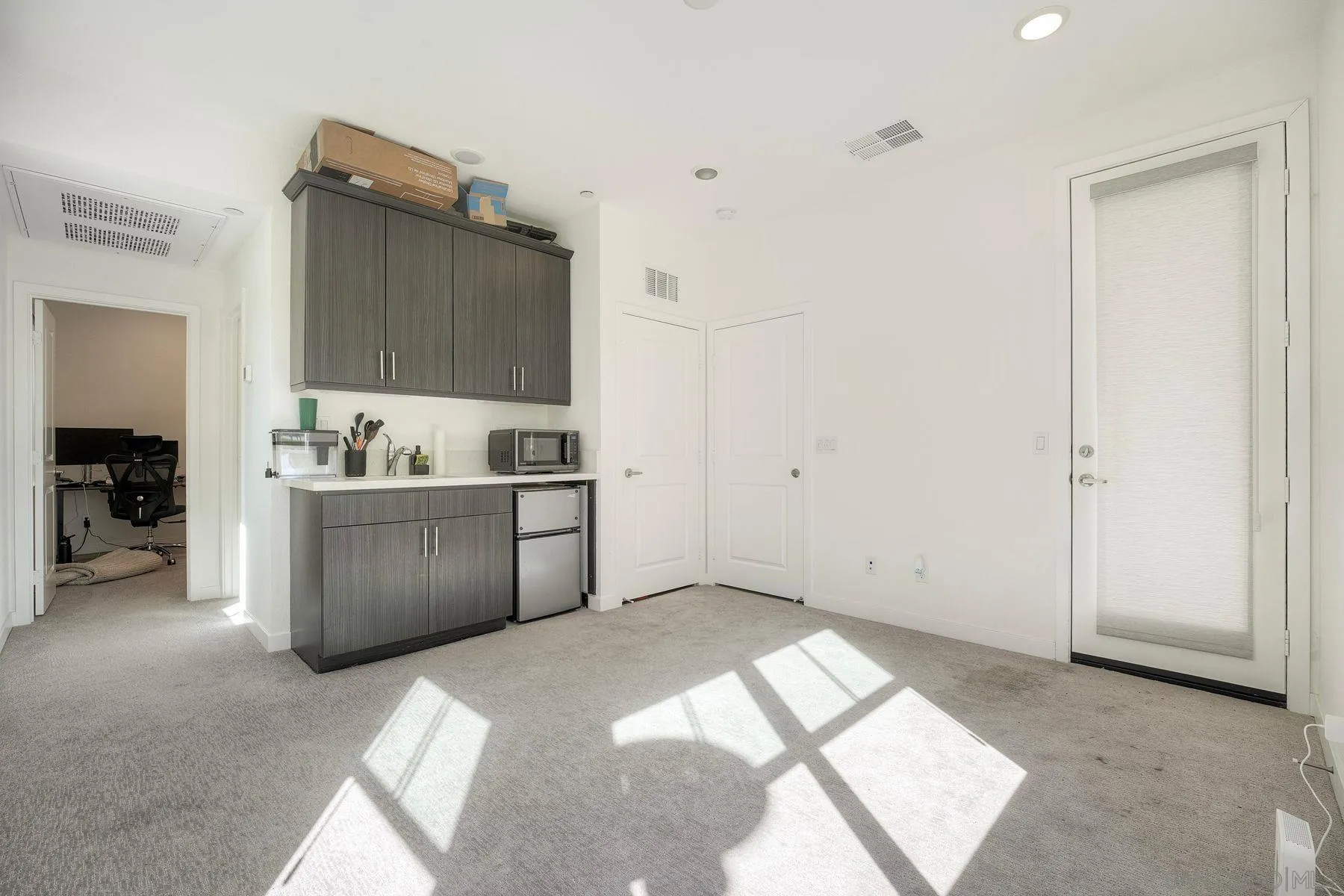 13087 Olympus Circle, Unit 2 Poway, CA 92064 - Photo 22 of 29 a view of kitchen with cabinets and wooden floor