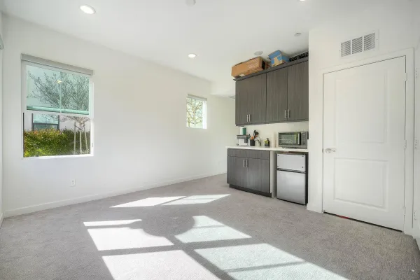 a kitchen with a refrigerator and window