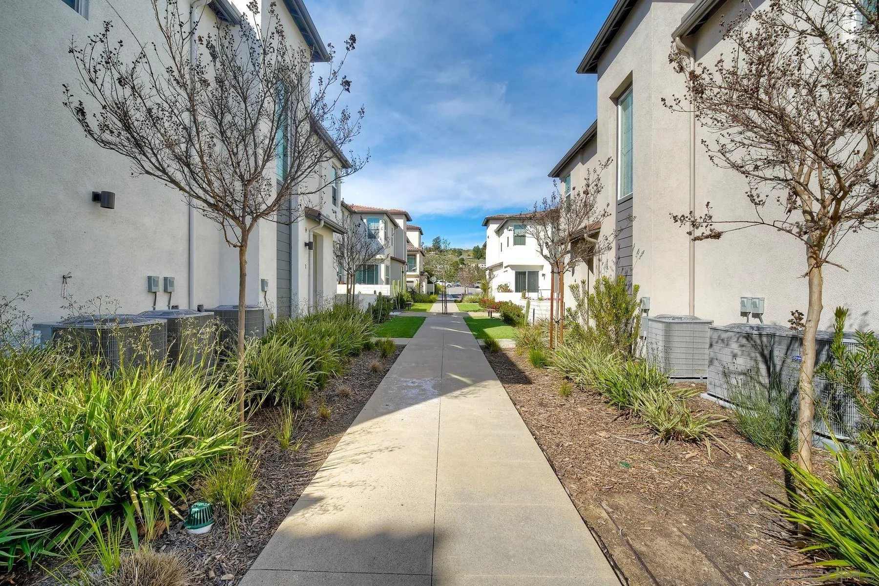 13087 Olympus Circle, Unit 2 Poway, CA 92064 - Photo 27 of 29 a view of a pathway with house on both side