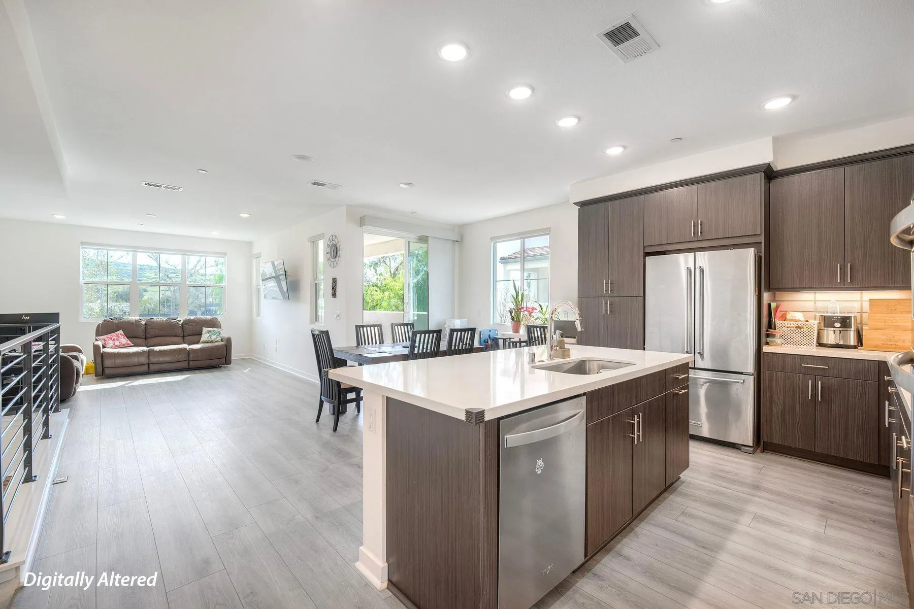 13087 Olympus Circle, Unit 2 Poway, CA 92064 - Photo 4 of 29 a kitchen with stainless steel appliances granite countertop a sink a stove and a refrigerator