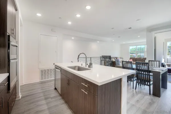 a kitchen with a sink and a refrigerator