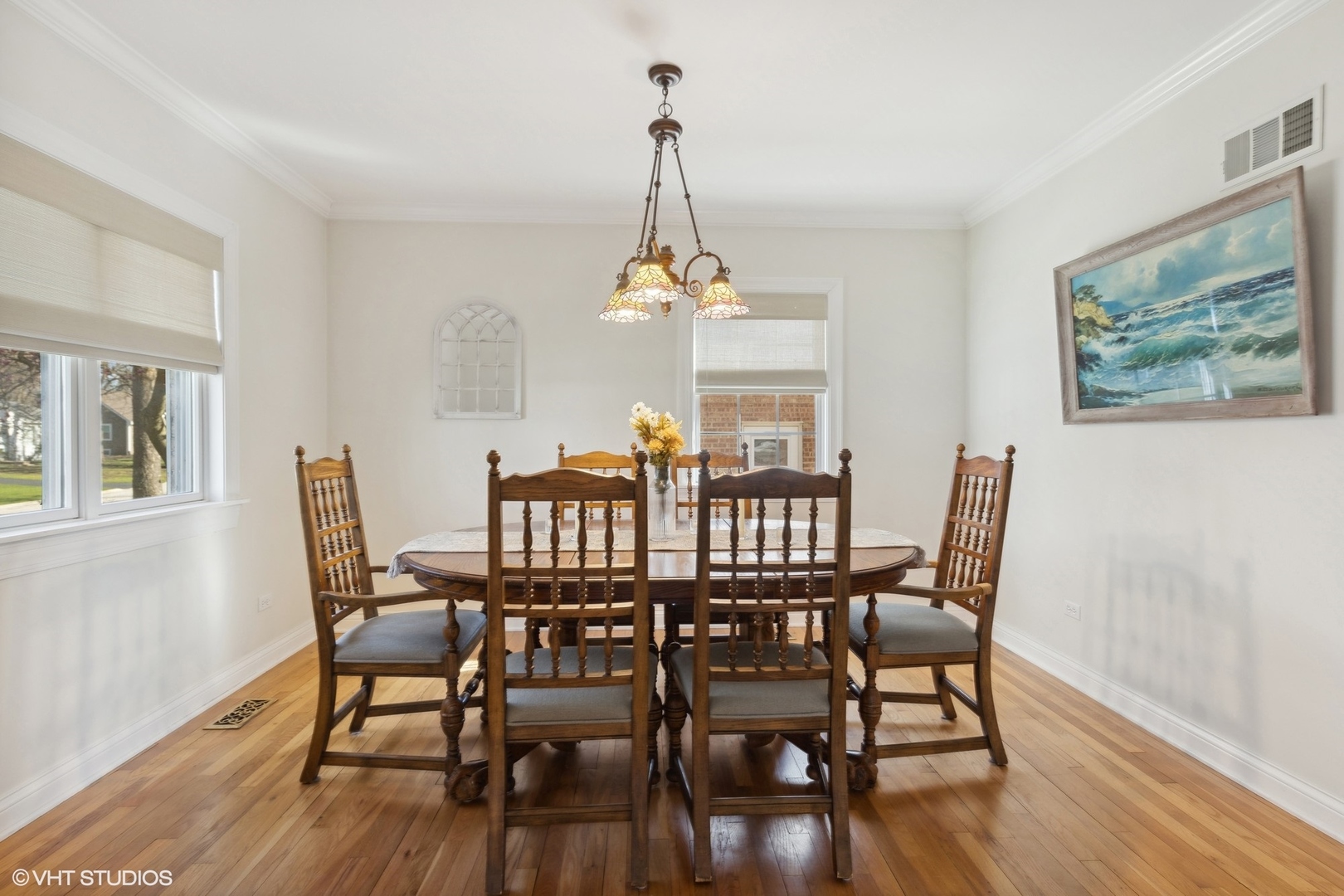 920 Sunset Road Wheaton, IL 60189 - Photo 7 of 27 a view of a dining room with furniture wooden floor and chandelier