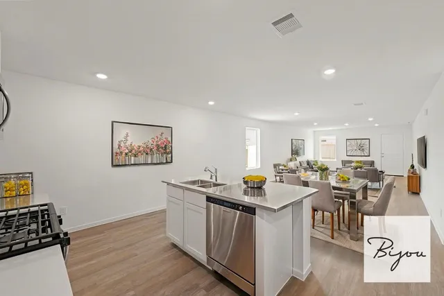 a view of a dining hall with furniture and wooden floor