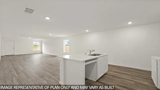 a view of a kitchen counter space and a sink