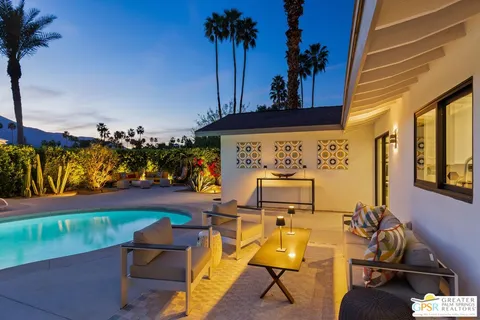 a view of a swimming pool with a patio
