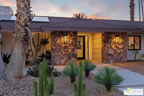 a view of front door and potted plants