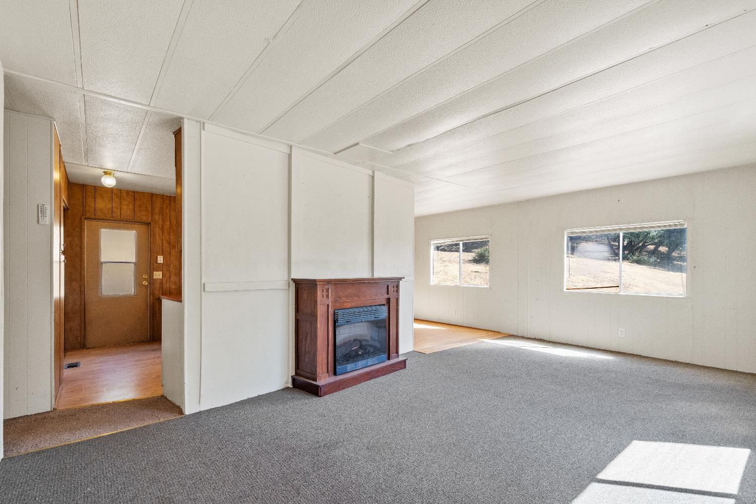 40882 Jean Road East Oakhurst, CA 93644 - Photo 15 of 32 a view of a livingroom with a fireplace