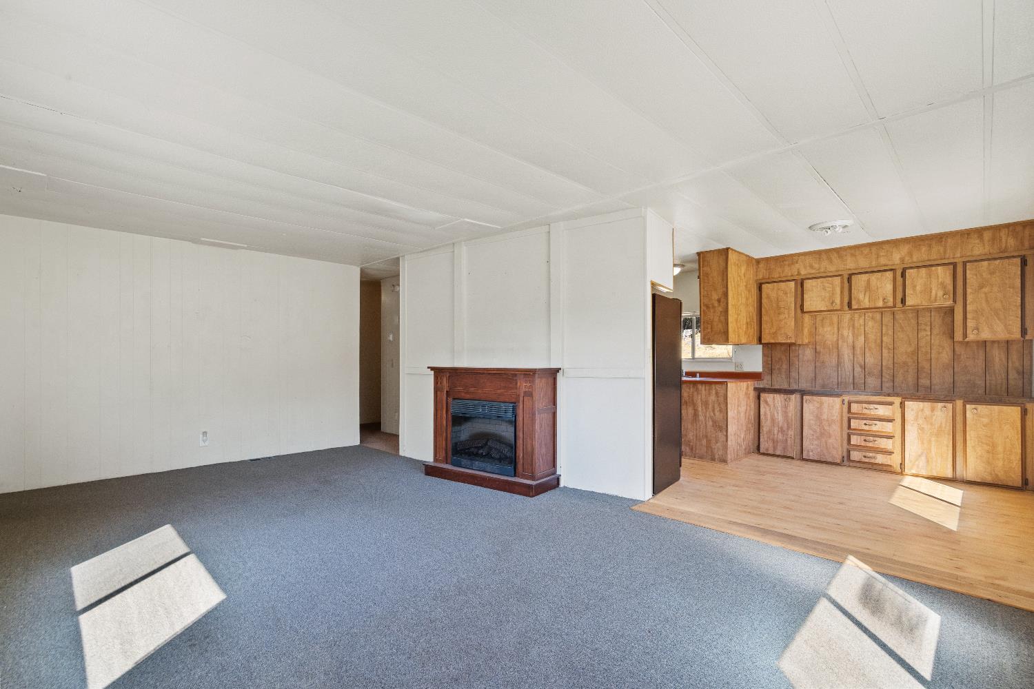 40882 Jean Road East Oakhurst, CA 93644 - Photo 16 of 32 a view of a livingroom with an empty space and a fireplace