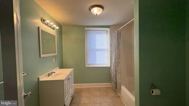 a bathroom with a shower and a bathtub