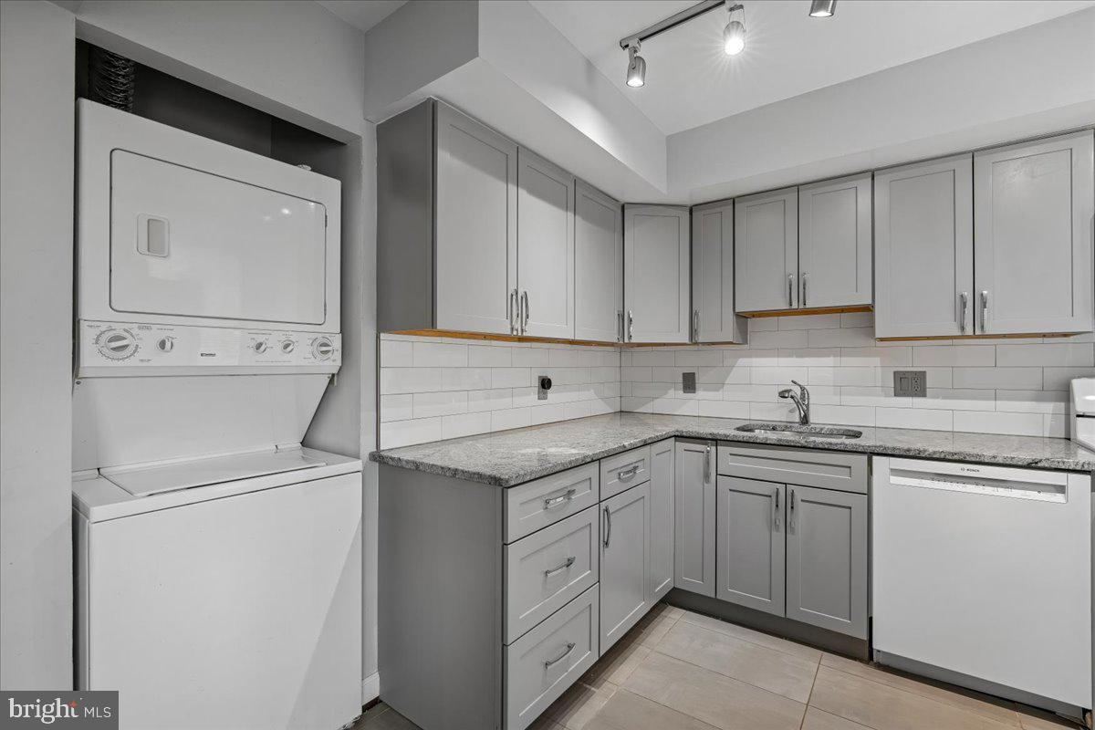 3940 Bel Pre Road, Unit 6 Silver Spring, MD 20906 - Photo 8 of 29 Sleek modern kitchen with laundry nook.