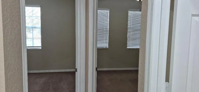 a bathroom with a toilet a sink and shower
