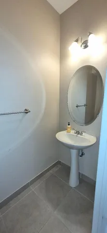 a bathroom with a sink and mirror