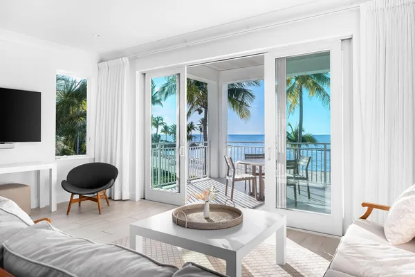a view of a balcony with ocean view