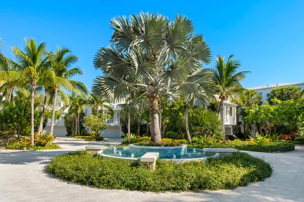 a view of a house with swimming pool and sitting area
