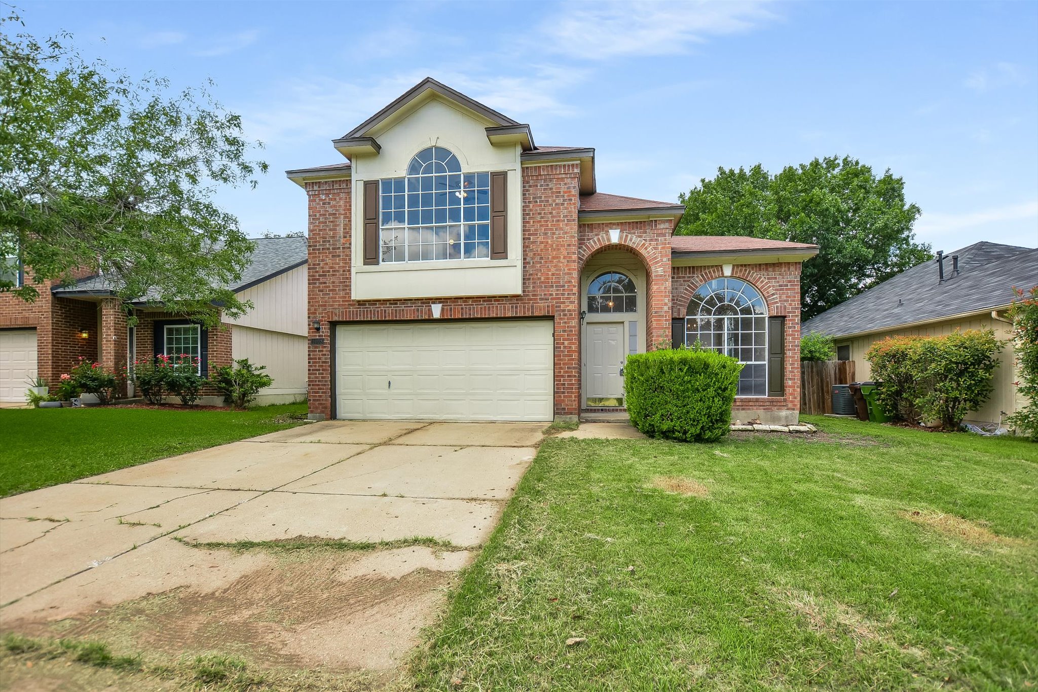 1008 Double File Trail Round Rock, TX 78665 - Photo 1 of 20 Brick facade with arched entryways defines this inviting two-story residence.
