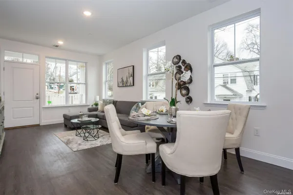 a living room with furniture a table and a window