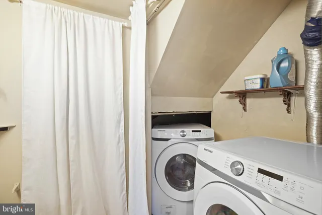 a utility room with dryer and washer