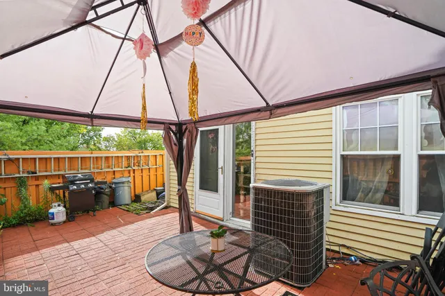 a balcony with furniture and wooden floor