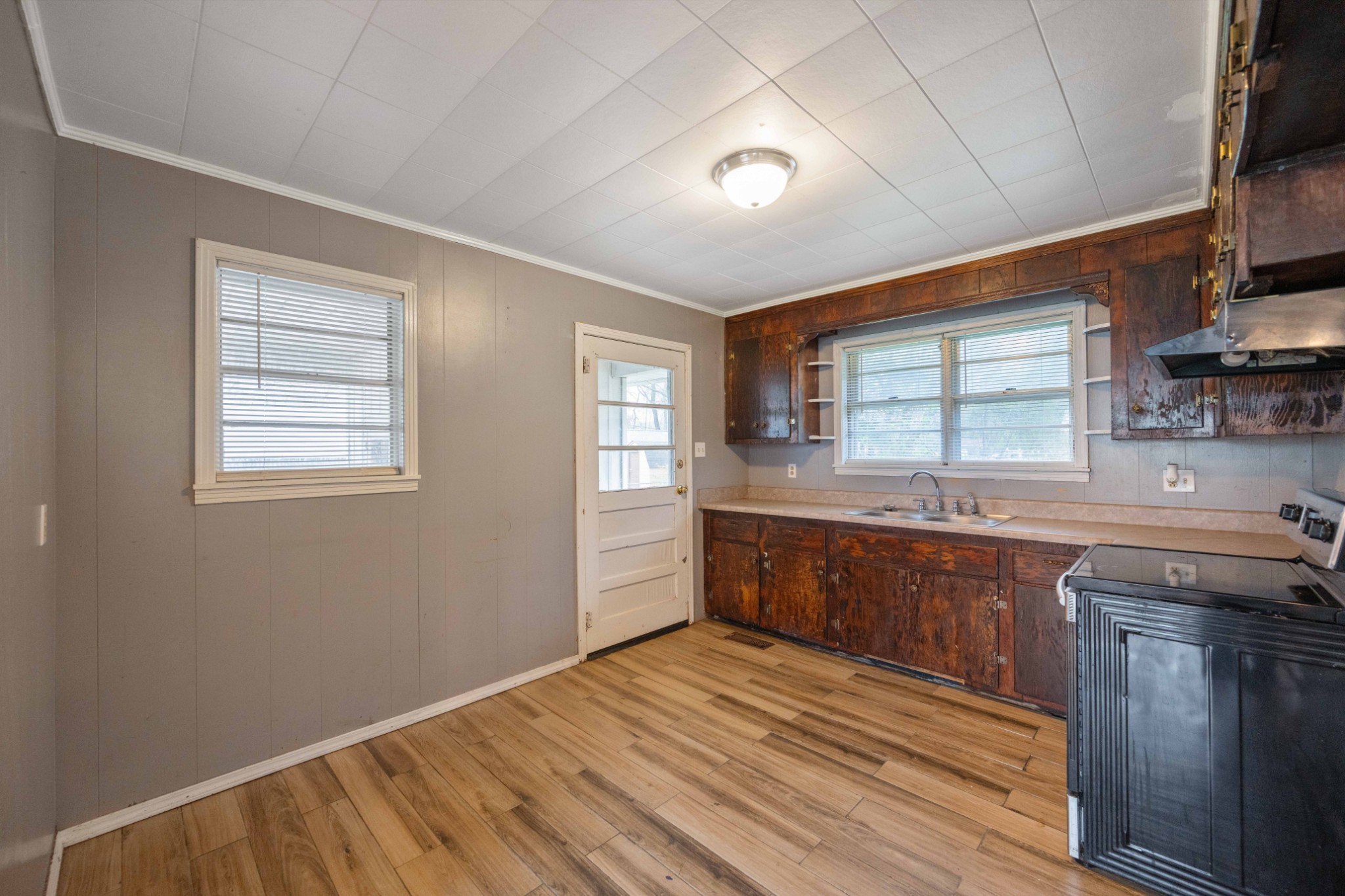 112 Brookside Drive Linden, TN 37096 - Photo 4 of 17 a kitchen with stainless steel appliances granite countertop a sink stove and cabinets