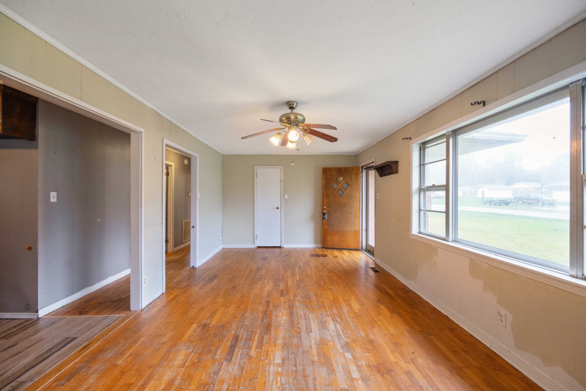 112 Brookside Drive Linden, TN 37096 - Photo 5 of 17 a view of empty room with wooden floor and fan