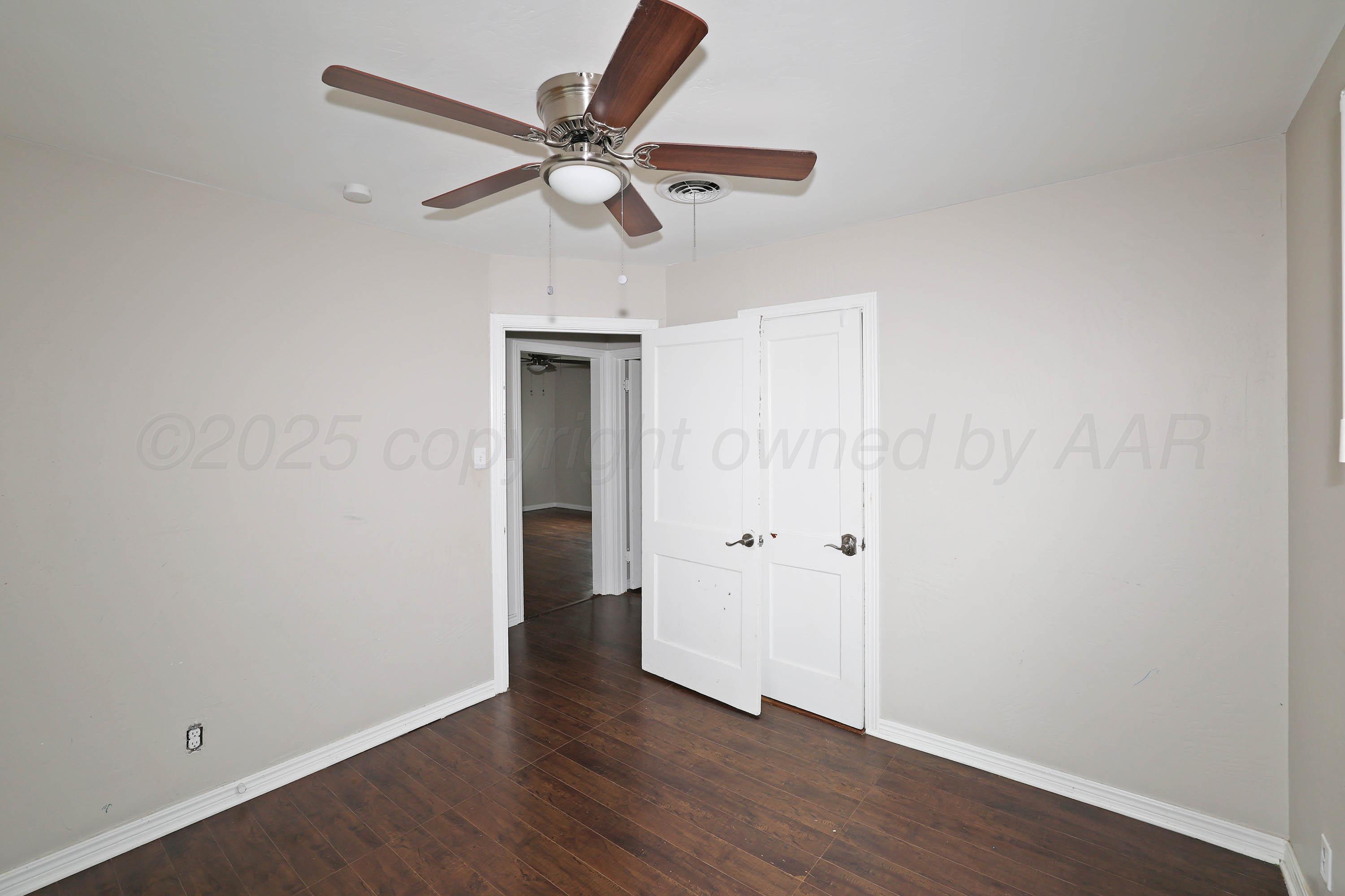 4112 South Tyler Street Amarillo, TX 79110 - Photo 13 of 20 wooden floor in an empty room