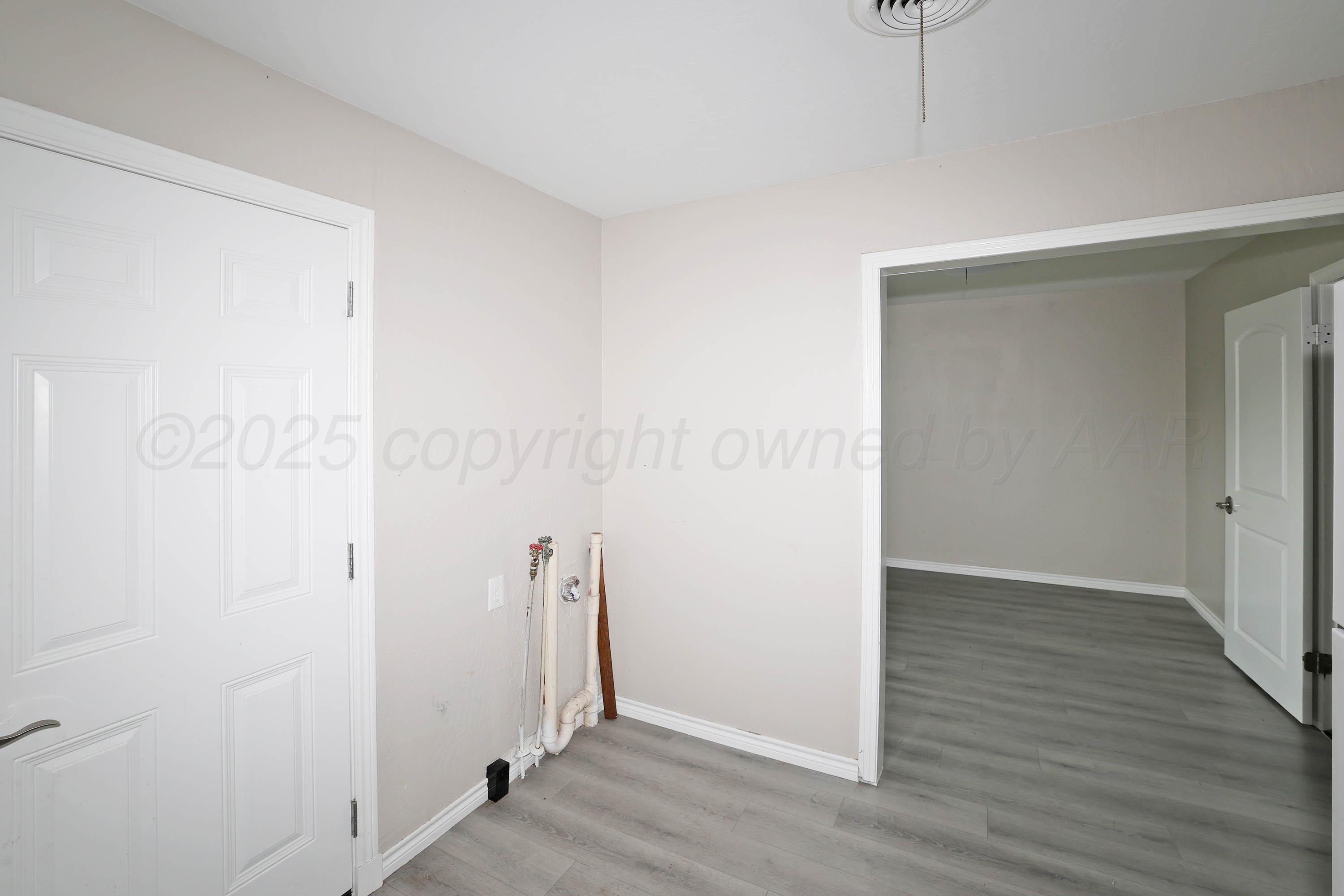 4112 South Tyler Street Amarillo, TX 79110 - Photo 8 of 20 wooden floor in an empty room