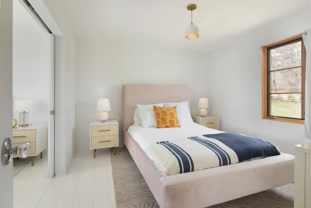 a bedroom with a bed and a couch