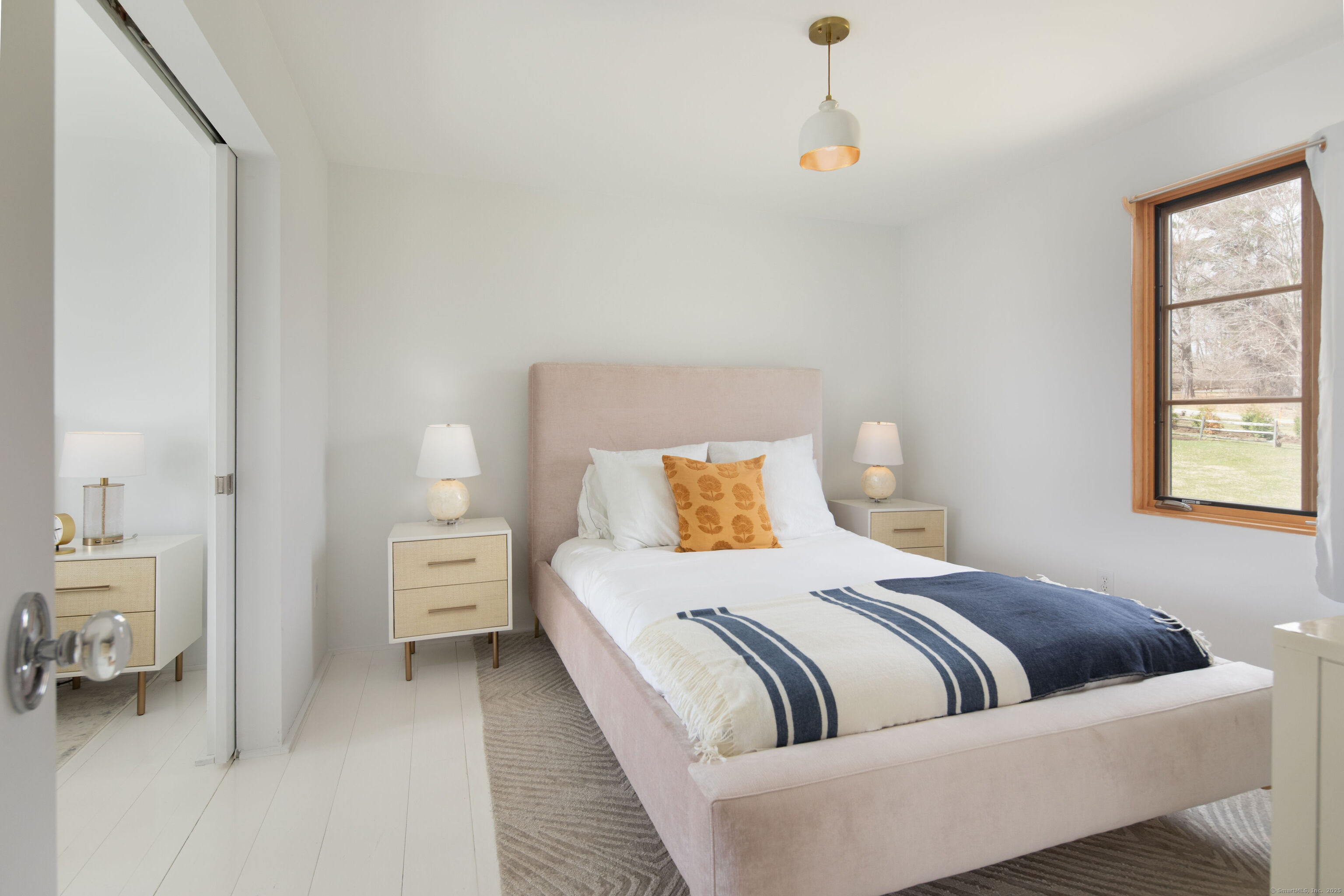 120 Lime Rock Road Salisbury, CT 06039 - Photo 22 of 35 a bedroom with a bed and a couch